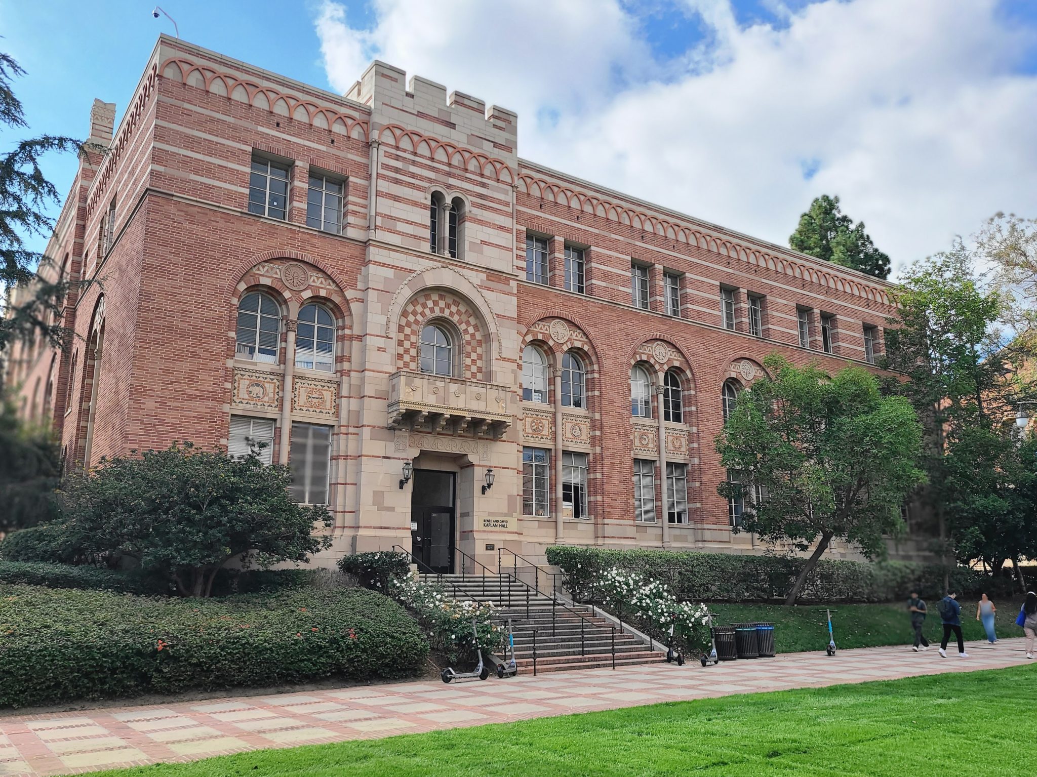 Kaplan Hall with students walling in front.